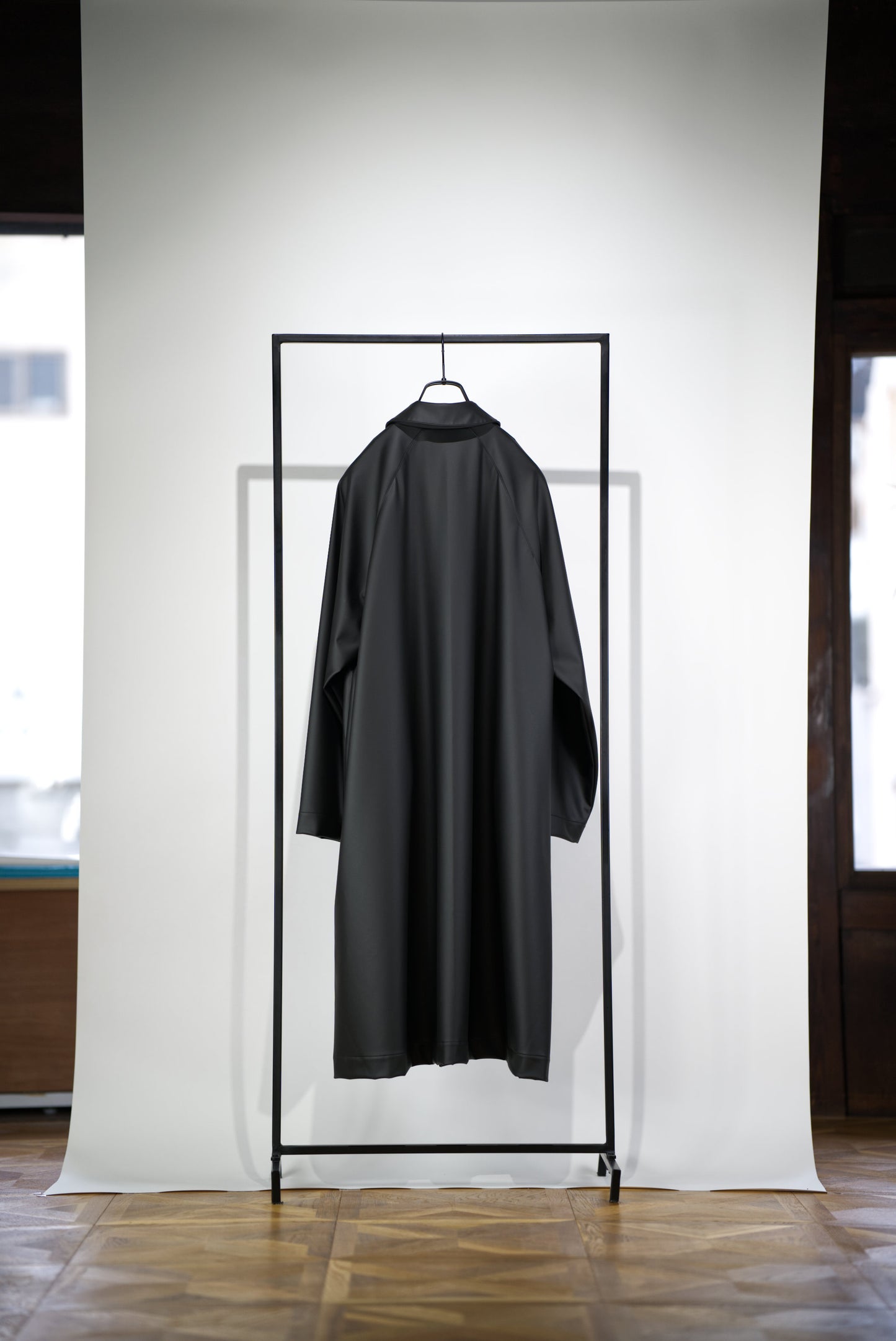 back side of the matt black bal collar coat in cactus leather