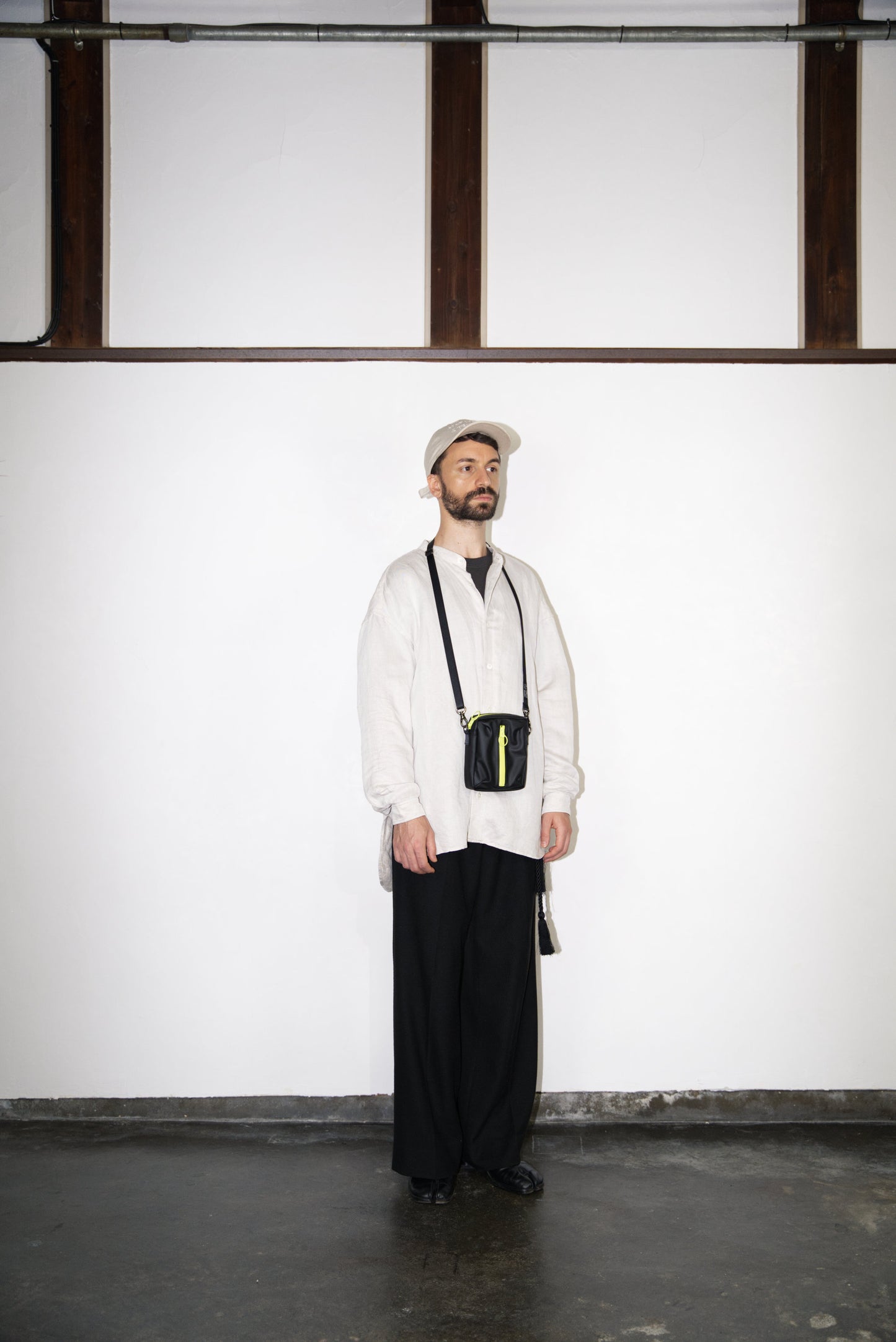 male model wearing the BOX Cactus Leather Mini Bag
