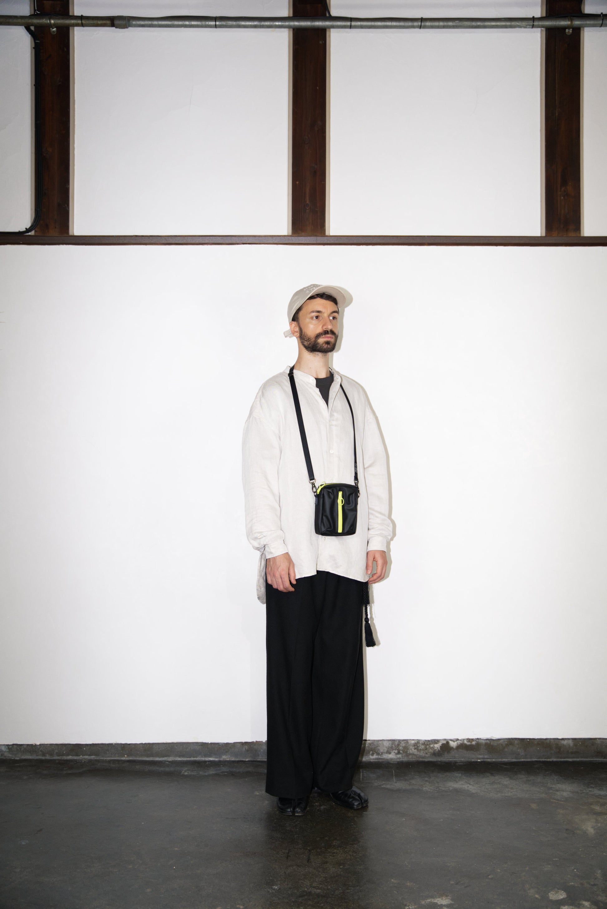 male model wearing the BOX Cactus Leather Mini Bag