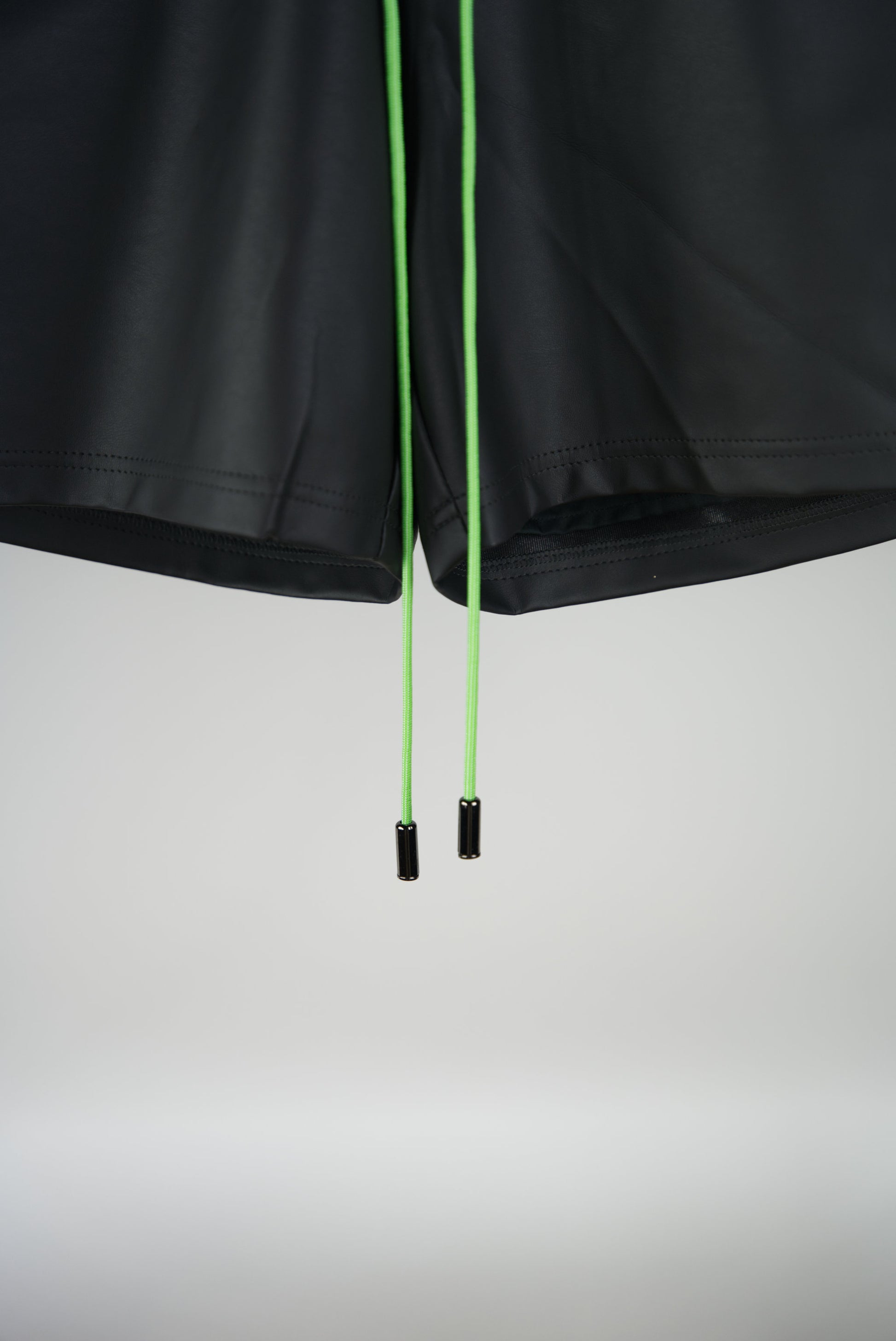 neon green paracord of the Hand-Stitched SCENE Cactus Leather Shorts