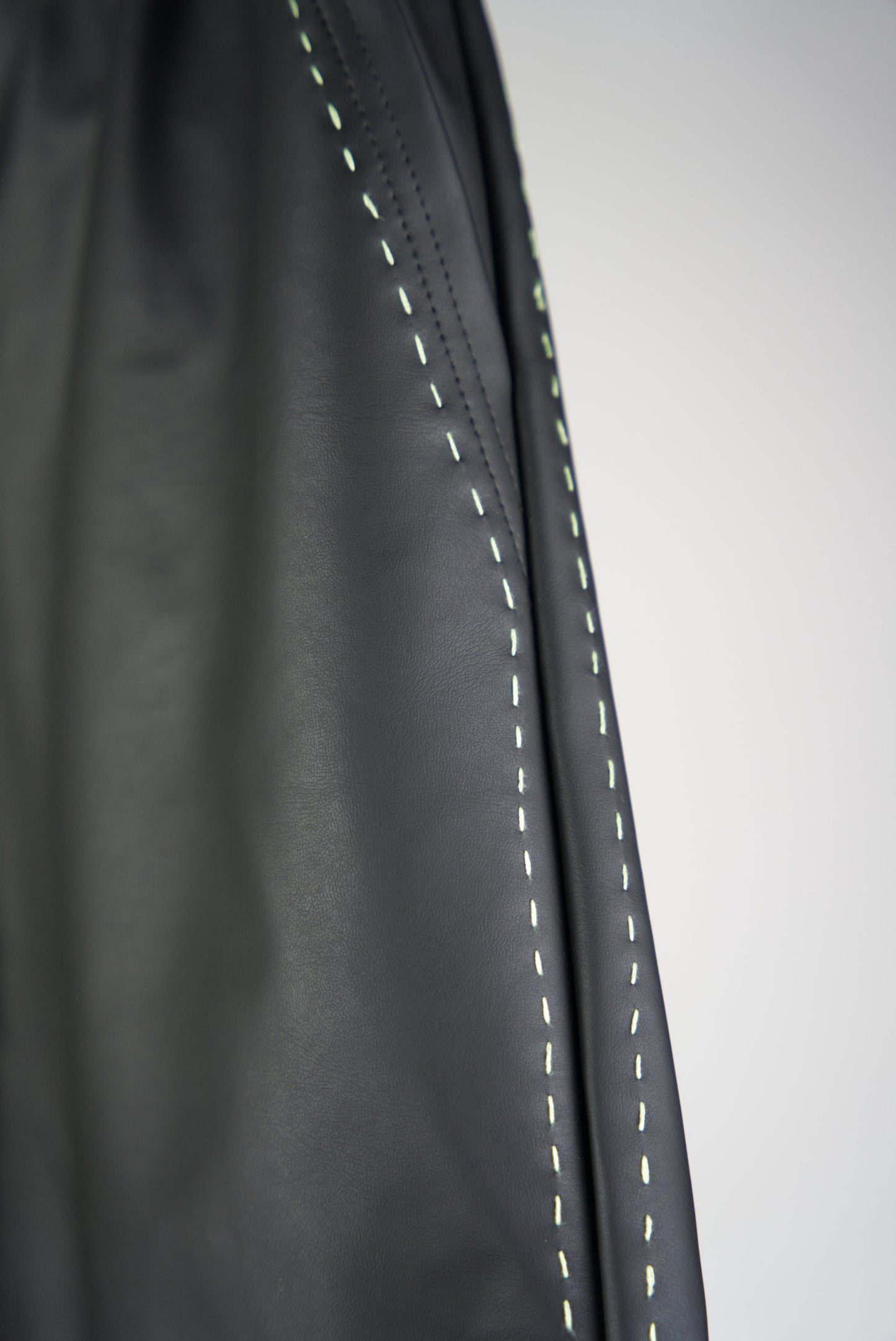 neon green hand-stitched details on the scene cactus leather shorts