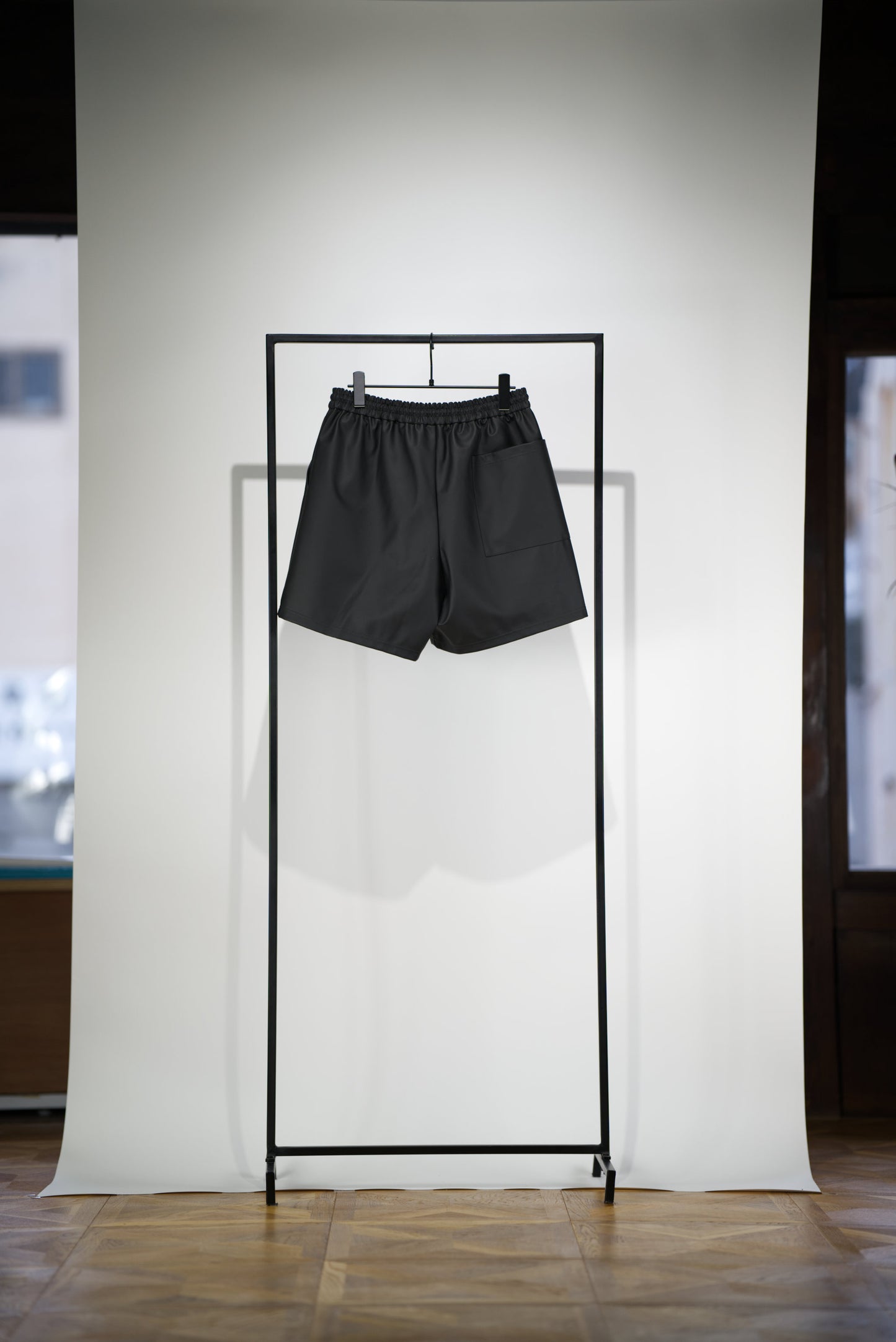 SCENE Cactus Leather Shorts hanging from rack