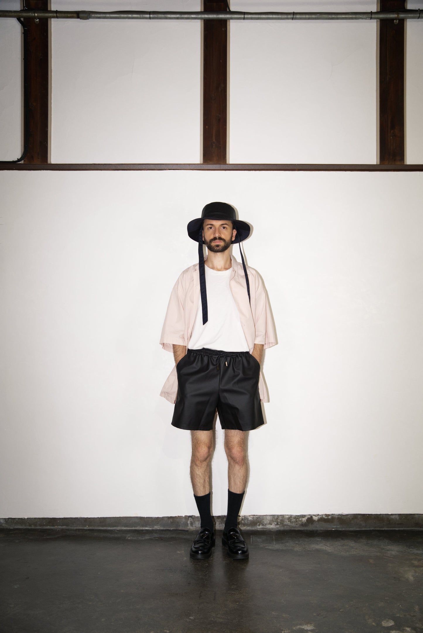 SCENE Cactus Leather Shorts on male mode wearing hat and shirtl