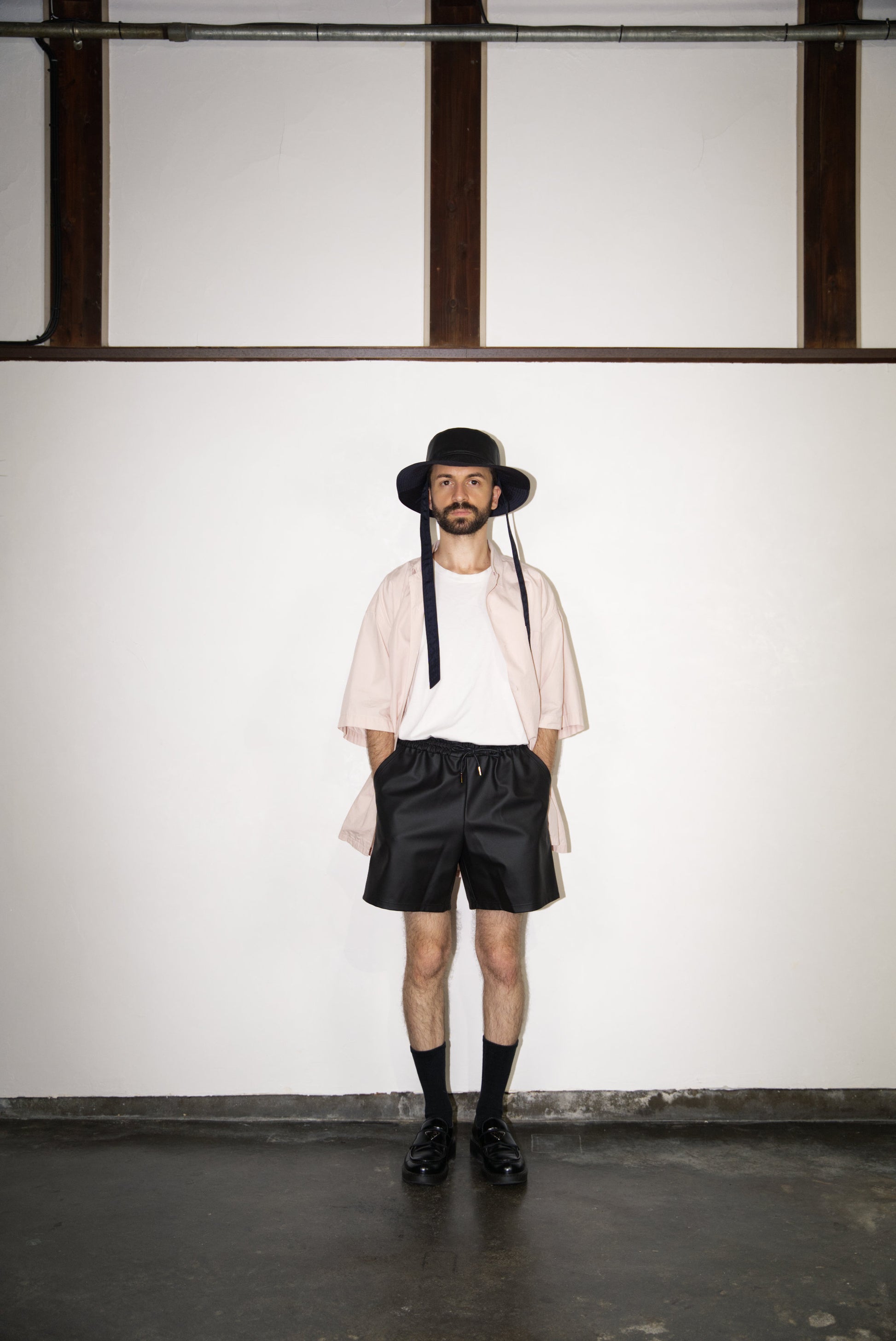 SCENE Cactus Leather Shorts on male mode wearing hat and shirtl