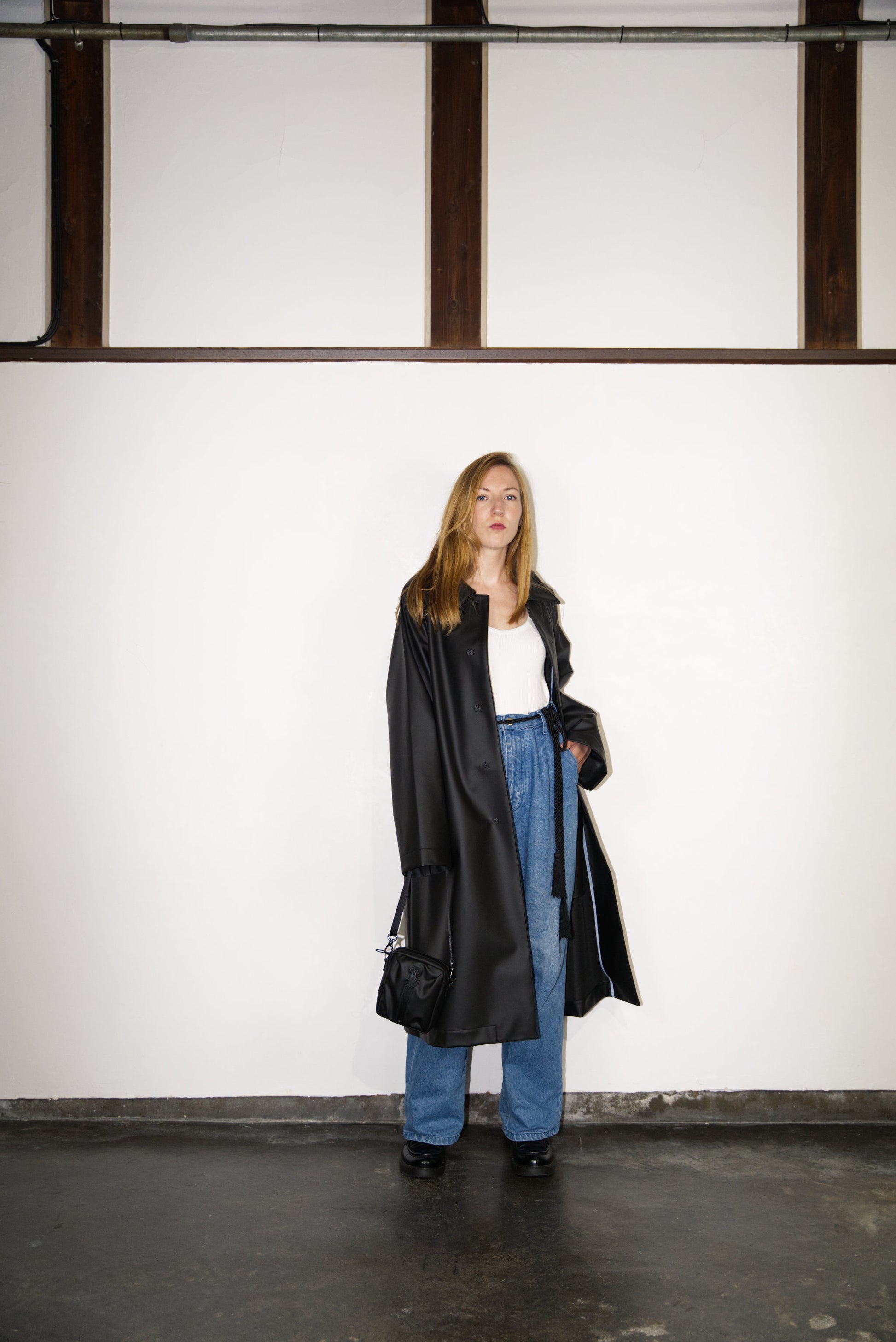 female model wearing the black BOX Cactus Leather Mini Bag