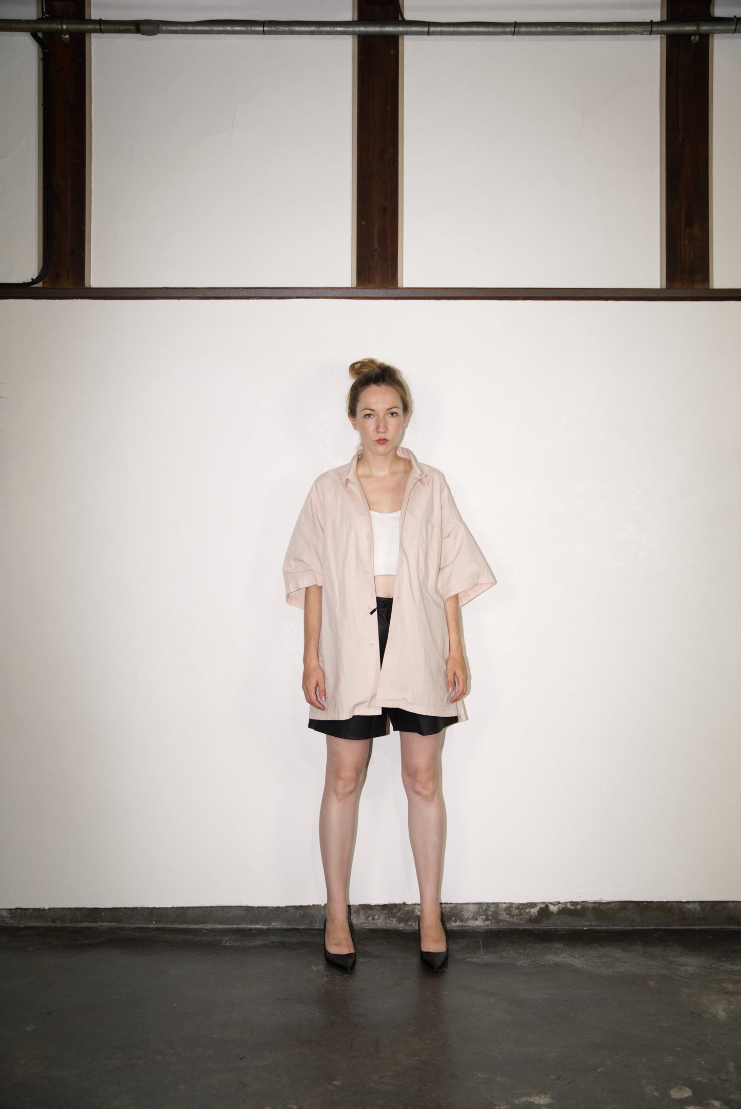 female model wearing SCENE Cactus Leather Shorts on male mode wearing hat and shirtl and shirt