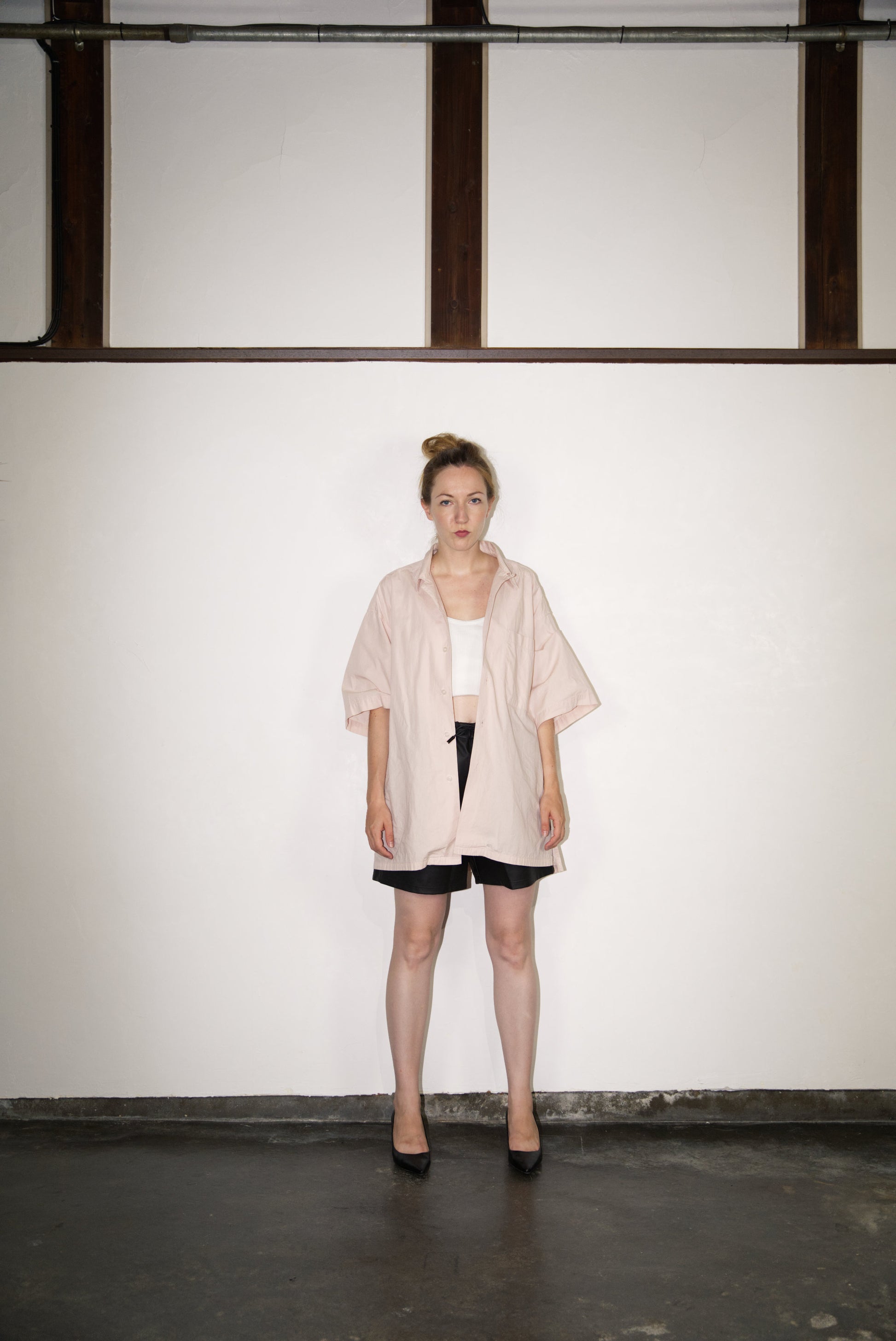 female model wearing SCENE Cactus Leather Shorts on male mode wearing hat and shirtl and shirt