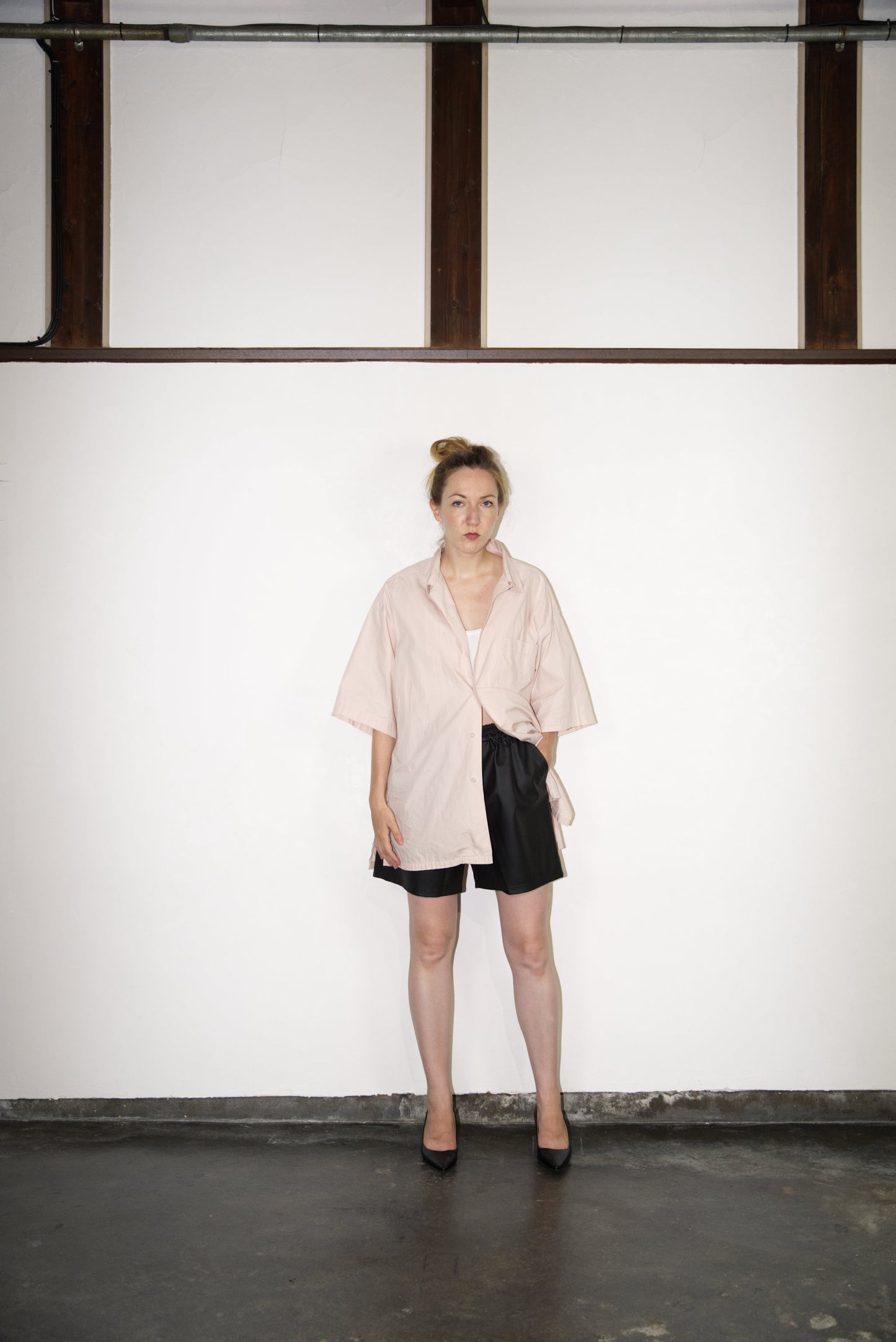SCENE Cactus Leather Shorts on female mode wearing pink shirt