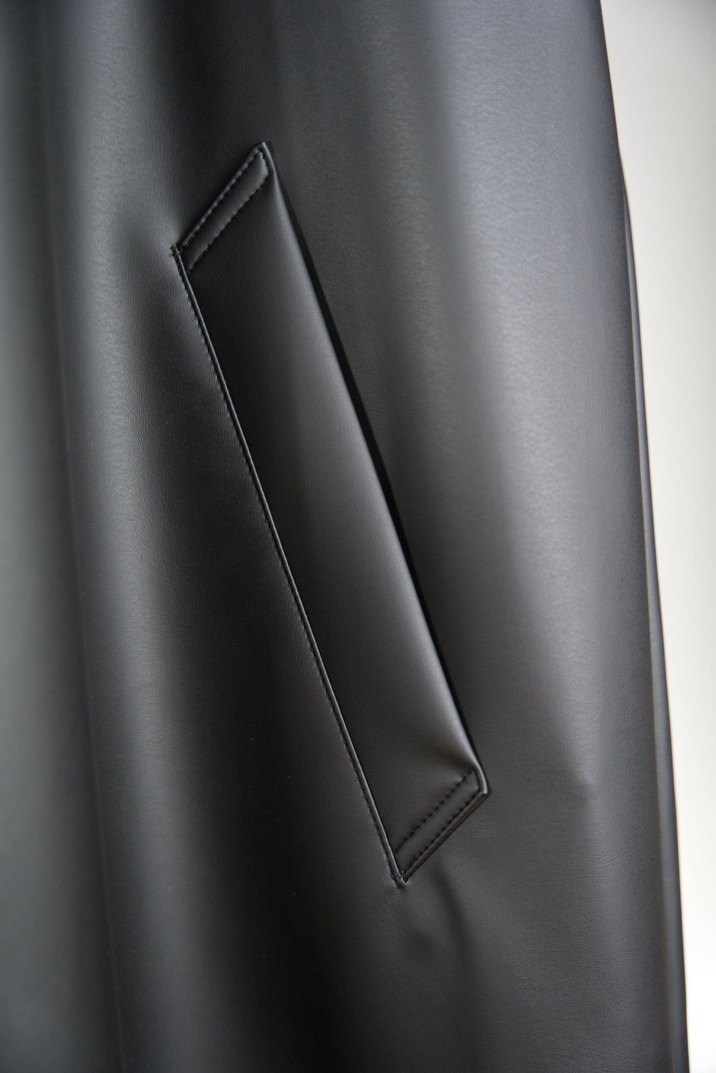 side pocket of the matt black bal collar coat in cactus leather