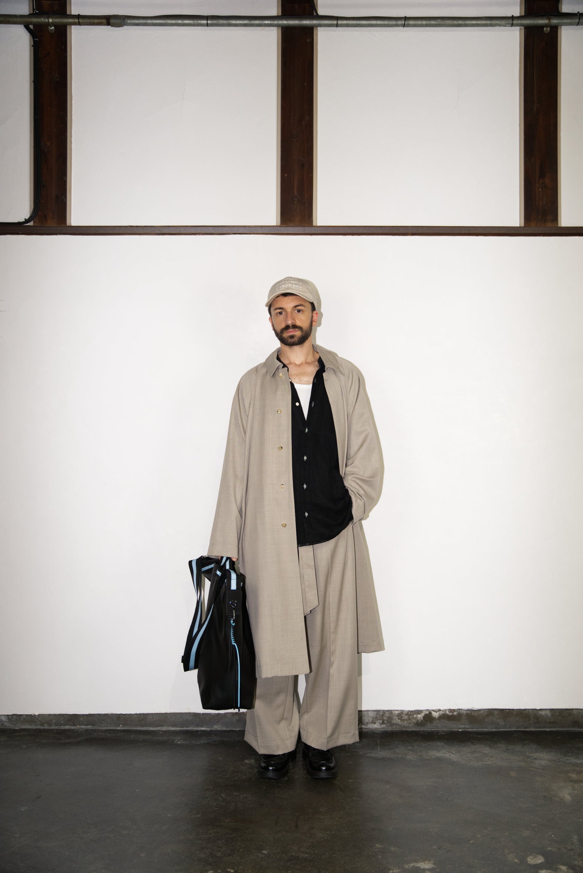 Belted Wide Flare Trousers in Wool on male model