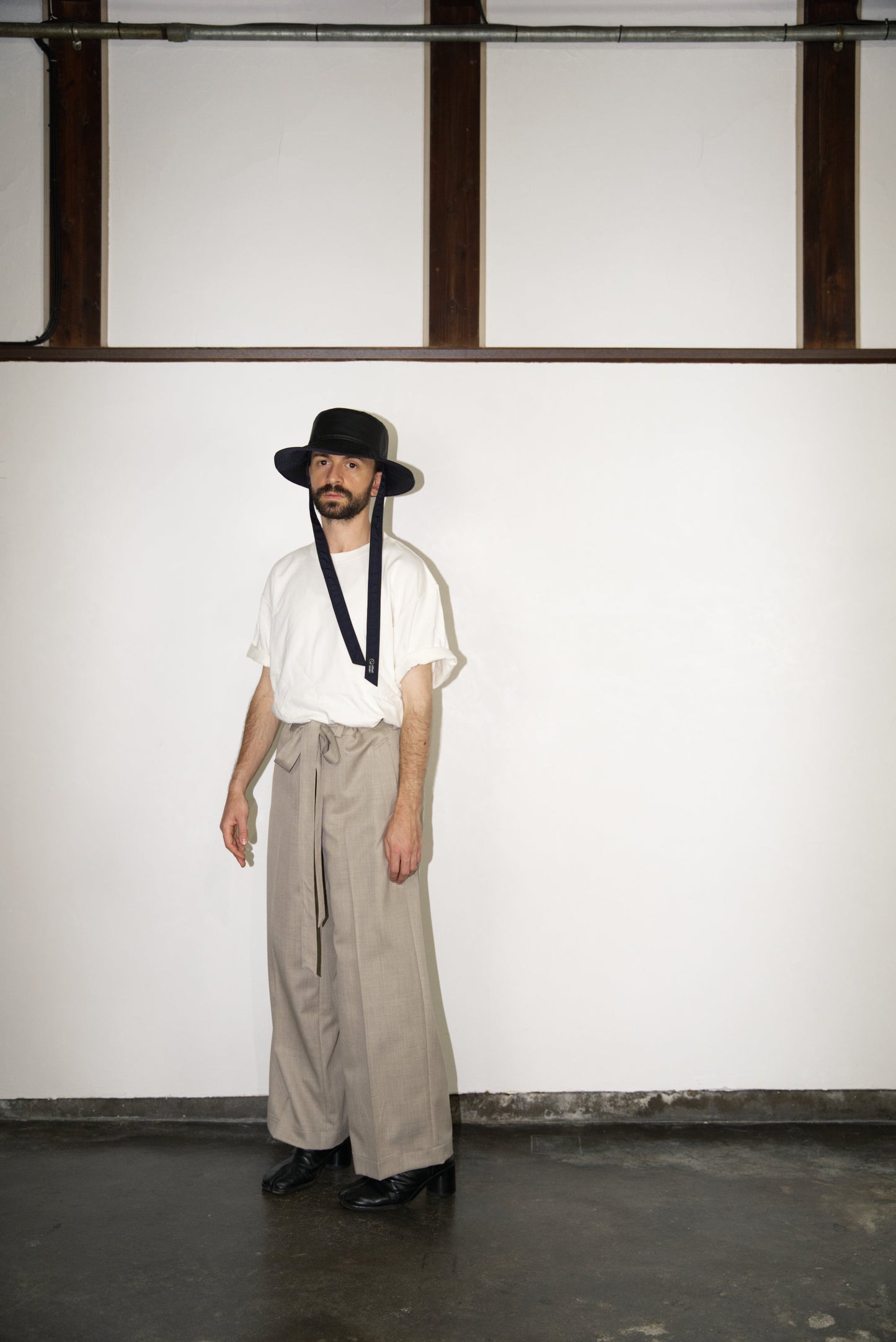 male model in Belted Wide Flare Trousers in Wool