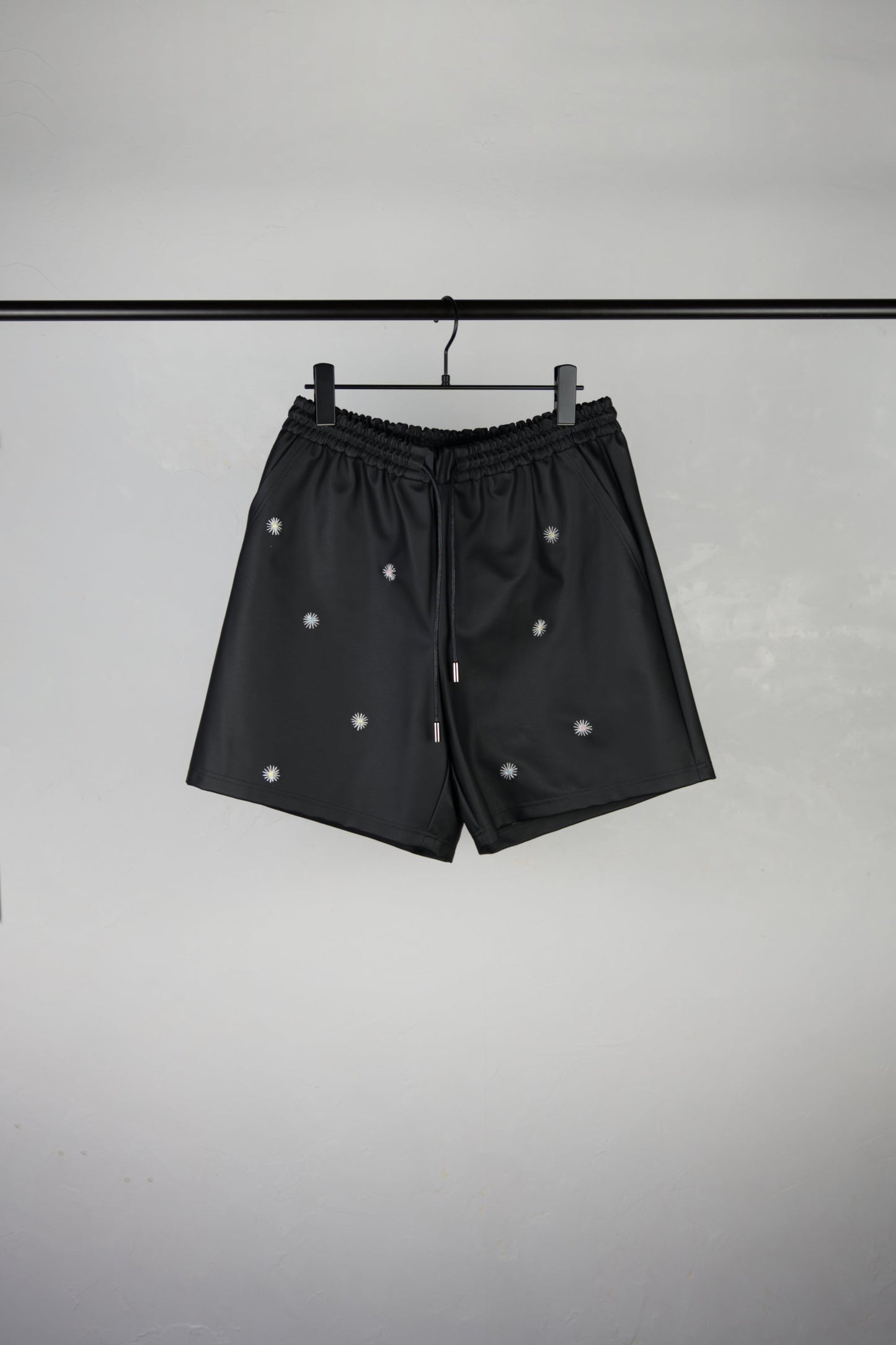 front side of hand-stitched scene cactus leather shorts in black