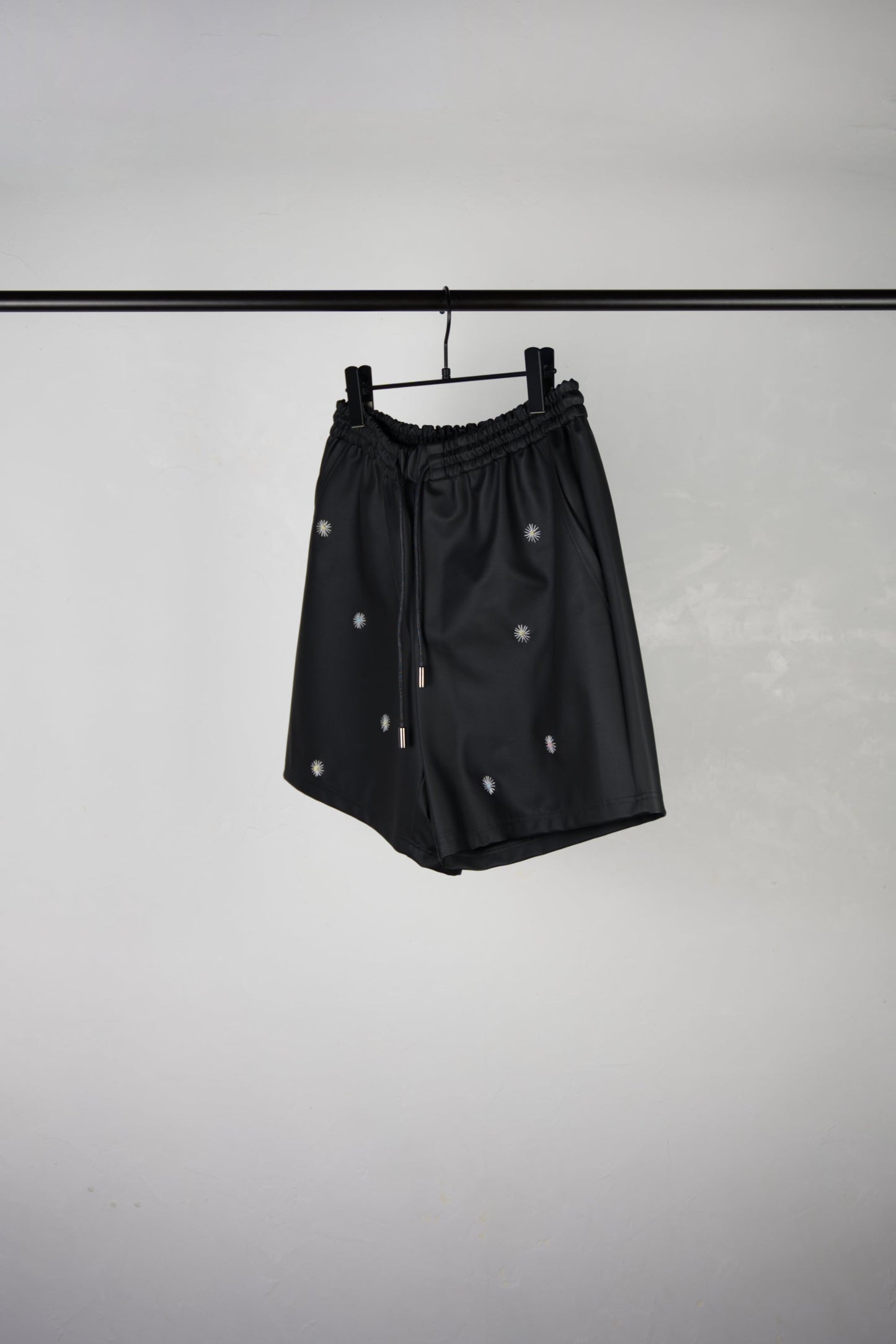 side of hand-stitched scene cactus leather shorts in black