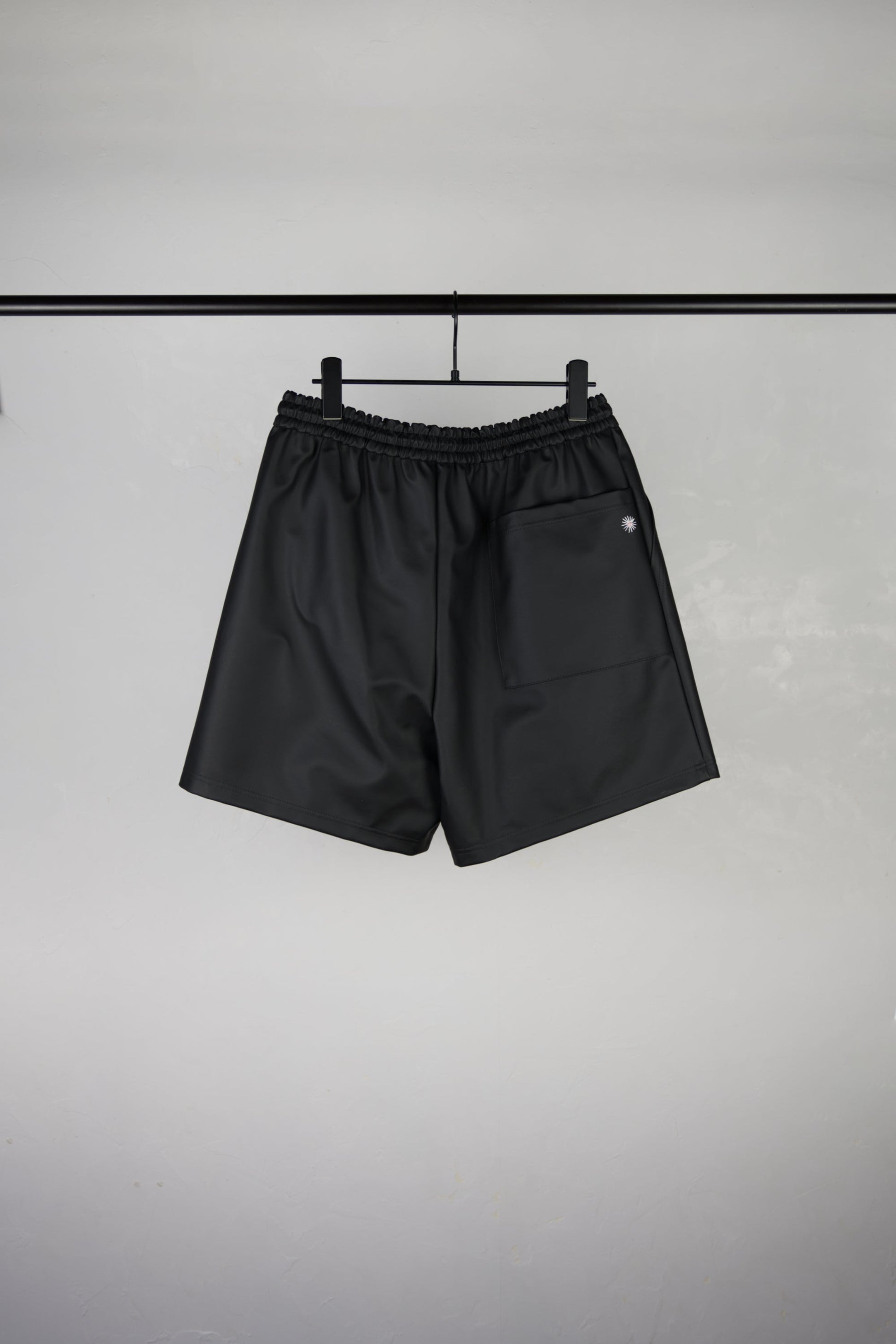 back side of hand-stitched scene cactus leather shorts in black